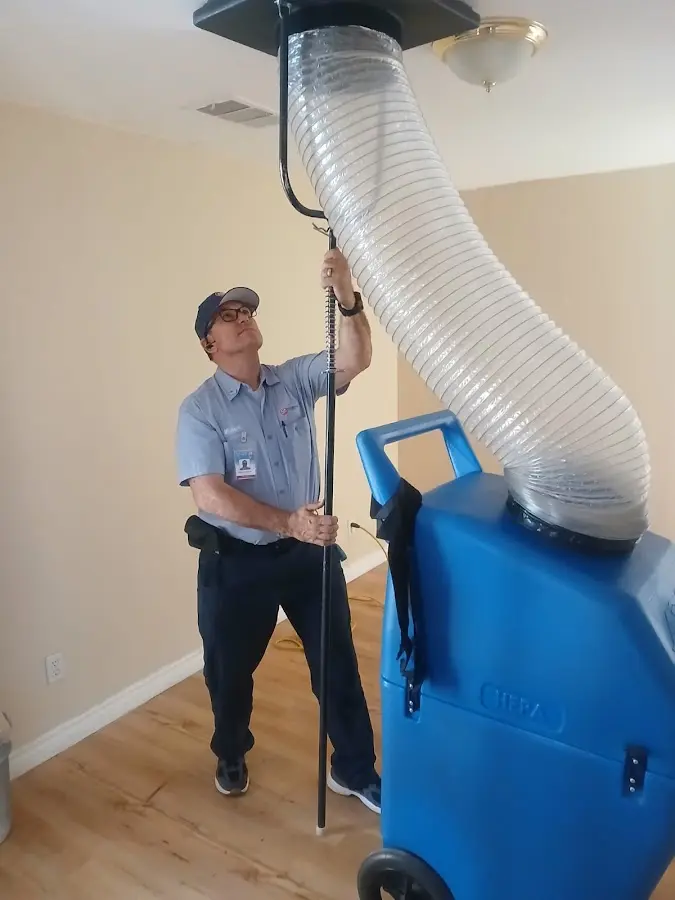 Furnace Tune-Up technician using HEPA equipment in Porters Neck